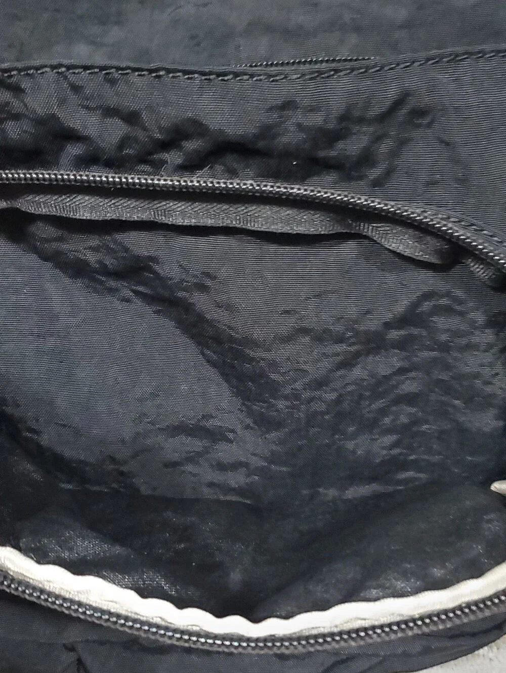 Kipling Queenie Small Backpack Black Nylon Brand Logo on the front flap.